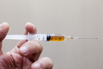 Syringe in a hand