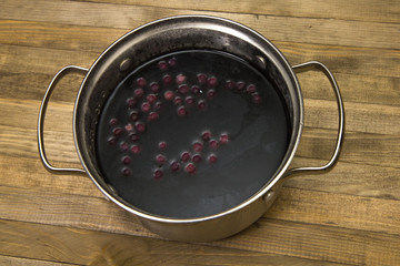 blueberries compote in steel pot