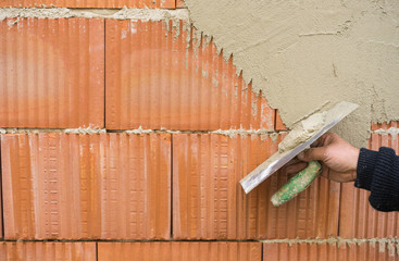 Mauer verputzen