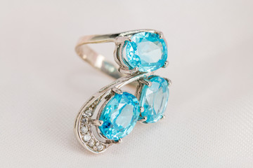 Old silver ring with blue topaz stone.