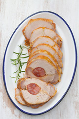 pork with smoked sausage on white dish