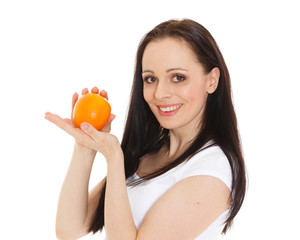 Beautiful young woman with an orange.