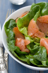 salad with smoked fish on white bowl