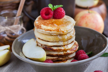 Breakfast with apple pancakes with honey