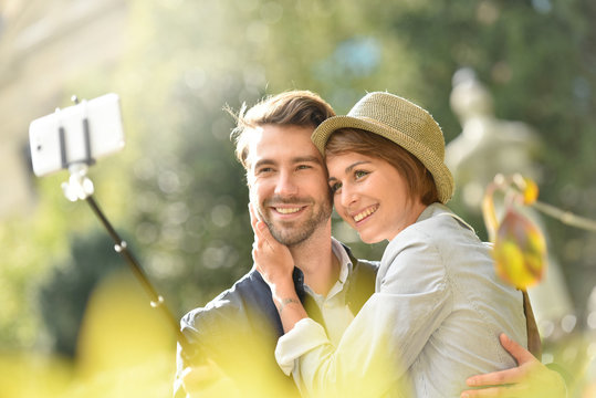 IN love couple taking selfie picture with smartphone