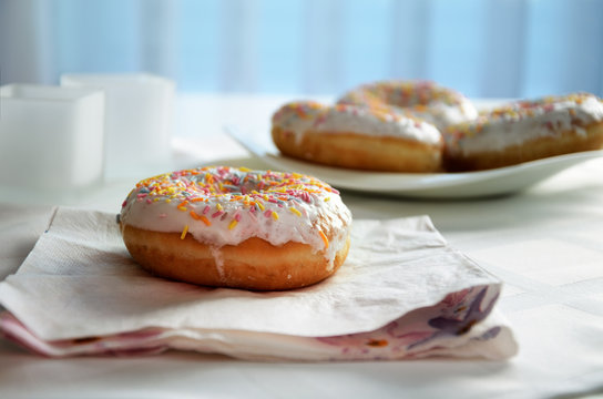 donut on the napkin on blue background. horizontal