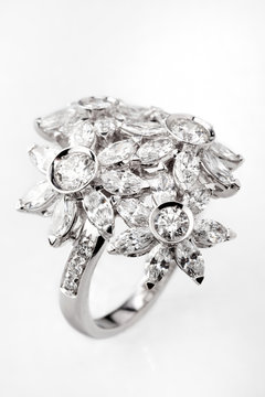 White Gold Or Silver Ring With Diamonds On White Background.