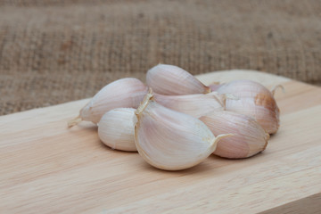Garlic on wooden cutting boards.