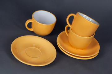 orange cup and saucer
