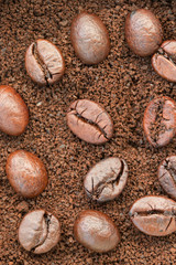 Top view : Coffee beans on coffee powder.