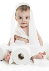 Toddler ripping up toilet paper in bathroom studio