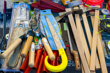 Hammers, saws, axes and other work tools for sale in a market in the Puglia region. Italy