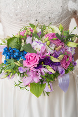 bride holds bouquet