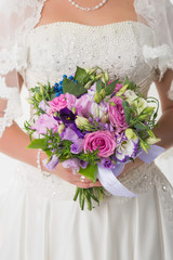 bride holds bouquet