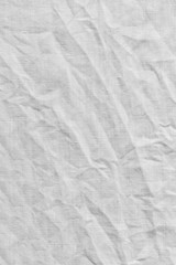Fototapeta na wymiar White canvas with delicate striped pattern, crumpled.