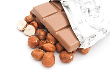 hazelnuts and chocolate on white