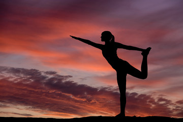 Yoga silhouette outdoor at sunset