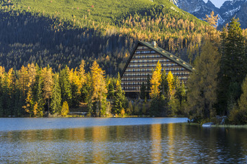 Autumn colored mountain lake on sunrise, Strbske lake, High Tatras, Slovakia