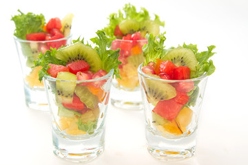 Colorful natural fruit salad in  glasses