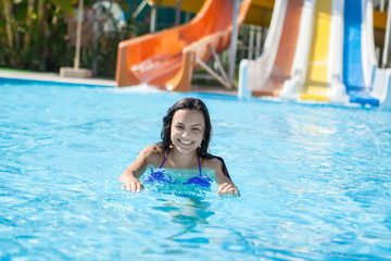 Naklejka premium girl in bikini sliding water park