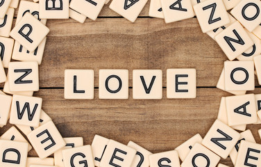 Love spelled out in tan tile letters
