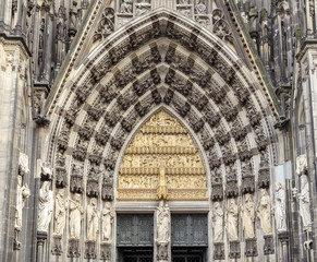 Fototapeta premium Cologne, Germany, the medieval portal, main entrance of the Dome