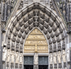 Fototapeta premium Cologne, Germany, the medieval portal, main entrance of the Dome