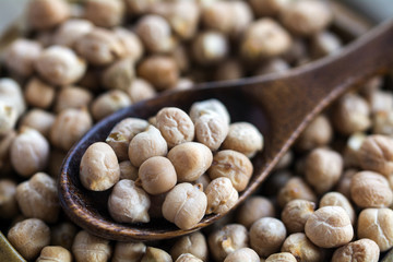 chickpeas with a wooden spoon, closeup shot