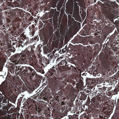 The surface of the brown marble in the background