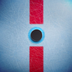 Hockey puck isolated on ice top view 