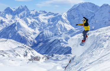 Naklejka na ściany i meble Snowboard guy's descent from the Elbrus mountain