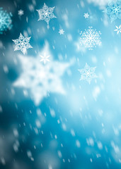 Fototapeta na wymiar winter background with snowflakes and place for text