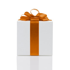 white paper gift box with orange ribbon bow isolated