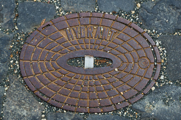 Cast iron manhole cover.