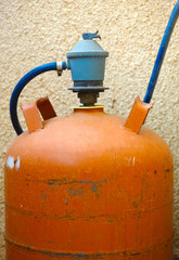 Orange gas bottle with gas regulator