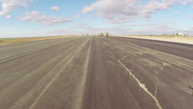 Freshly paved asphalt on an airport runway