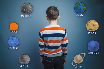 teenager boy turned his back on the planets of the solar system 
