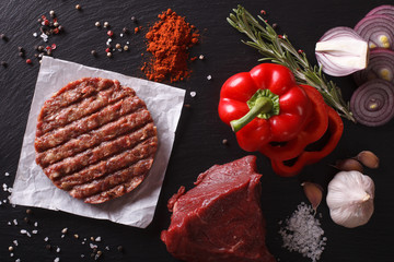 Raw Ground beef Burger steak cutlets with ingredients. horizontal top view 
