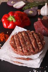 Cooking burgers cutlets close-up and ingredients. vertical

