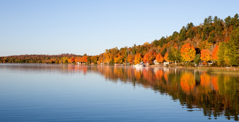 Fall Colors Reflected in a Calm Lake - 95829819