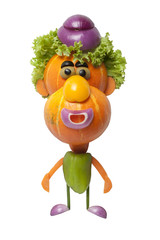 Funny man made of pumpkin, salad and cucumber