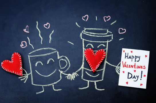 cups of coffee with toy hearts drawn on the chalkboard