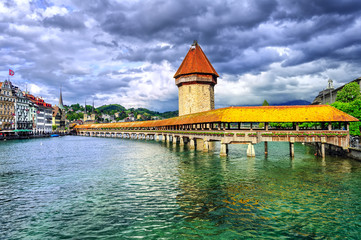 Lucerne, Switzerland, medieval wooden Chapel bridge over Reuss river and Water tower