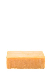 A block of cheddar cheese over white background