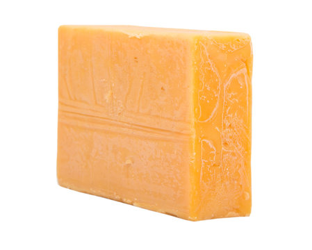 A block of cheddar cheese over white background