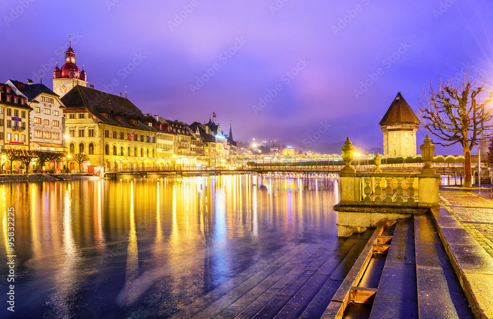 Wall mural Lucerne, Switzerland. View over Reuss river to the old town and Water tower