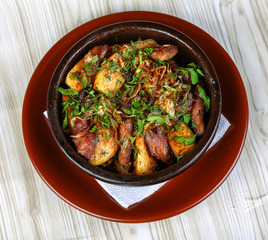 Baked potato with pork meat