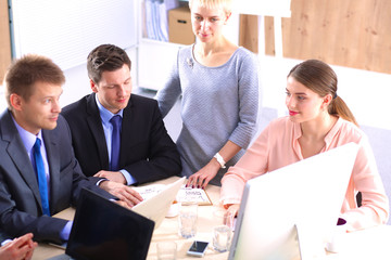 Business meeting -  manager discussing work with his colleagues