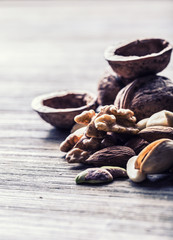 Almonds, walnuts and hazelnuts on wooden table. Various kinds of nuts