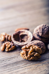 Almonds, walnuts and hazelnuts on wooden table. Various kinds of nuts
